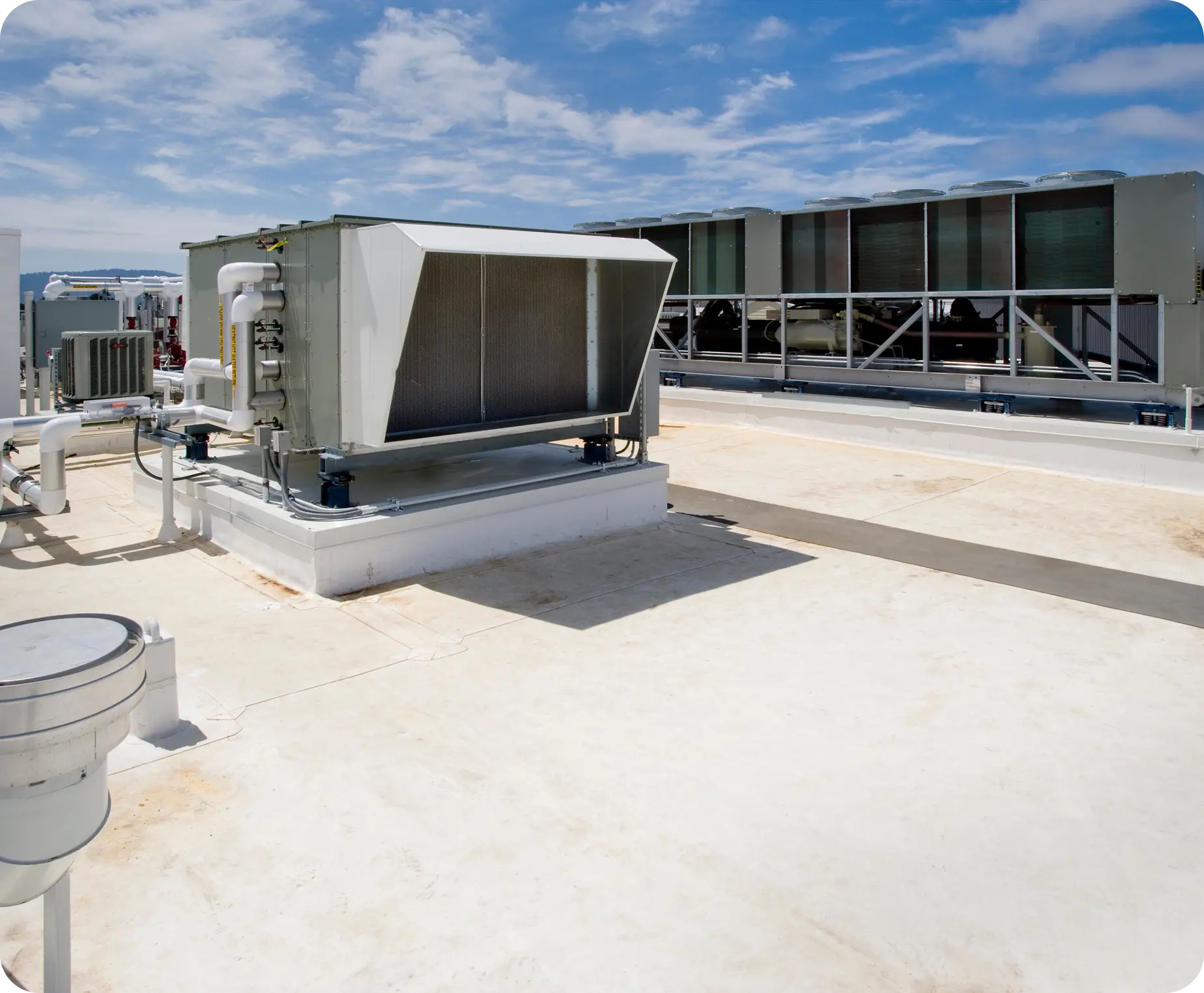 Rooftop HVAC units under a clear sky.